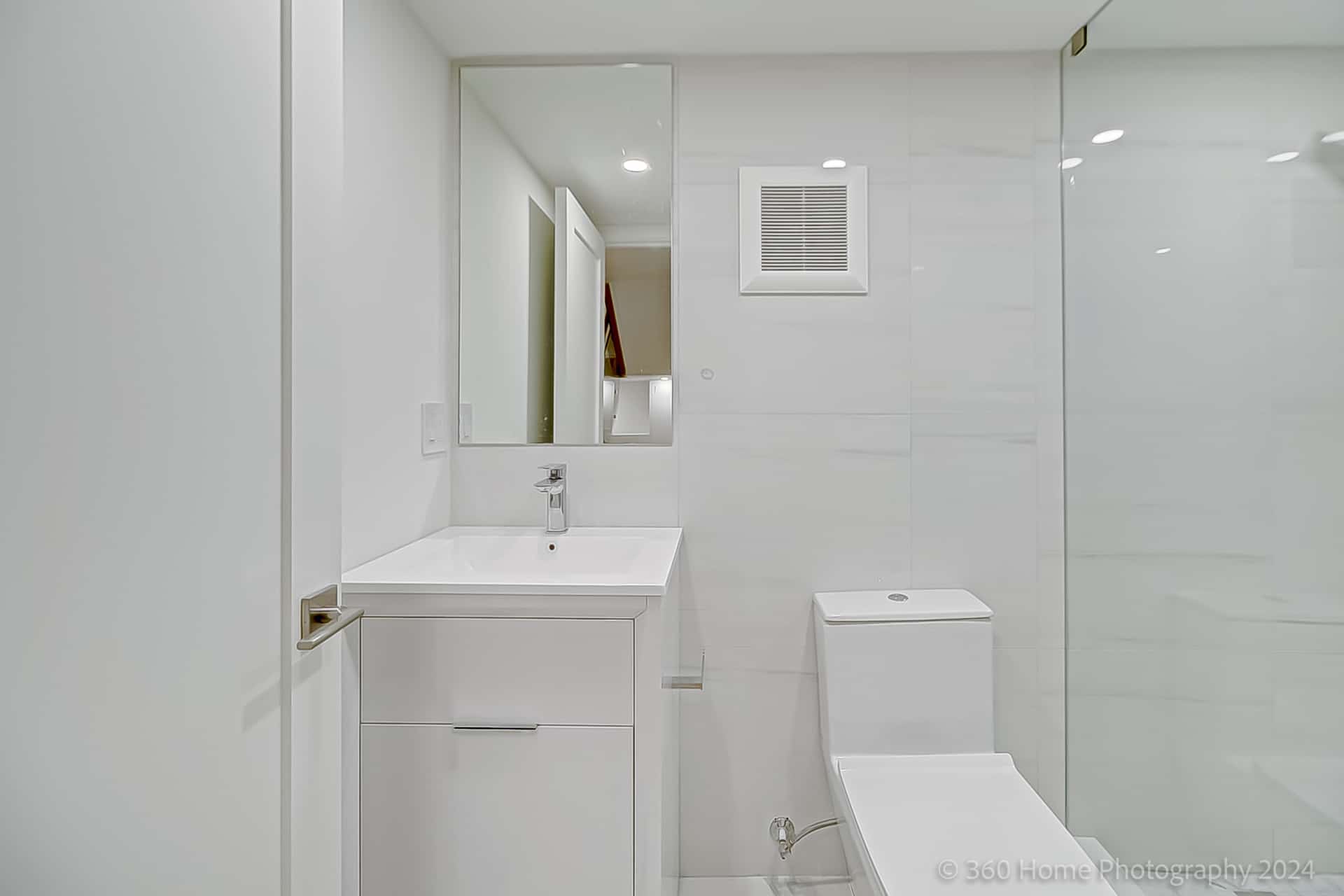 Basement bathroom at 100 Glenvale Blvd with white tile and glass shower