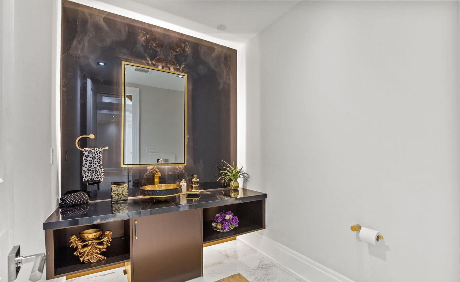 Walk-in dressing room with custom cabinetry