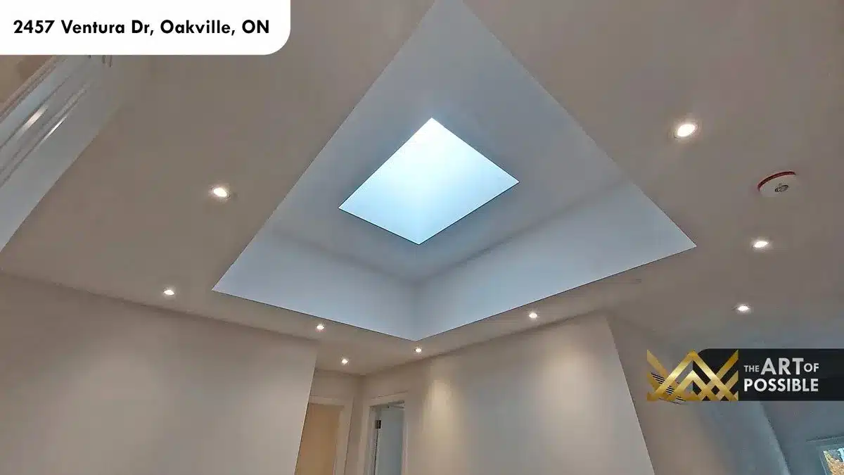 Skylight set into pyramidal ceiling recess in primary suite at 2457 Ventura Dr Oakville
