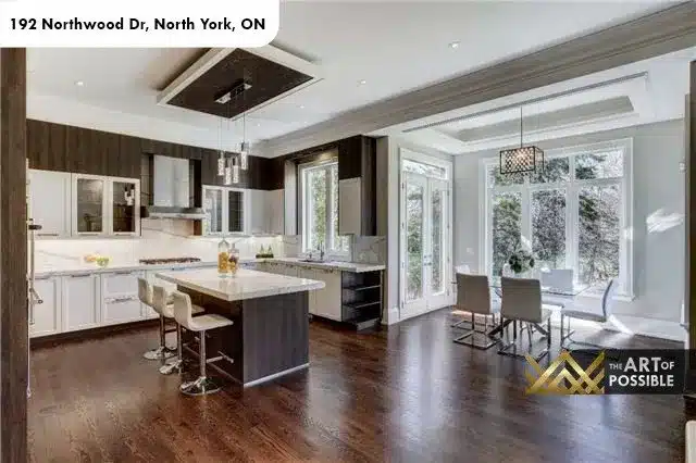 Open-concept kitchen and breakfast room with floor-to-ceiling windows, 192 Northwood Dr