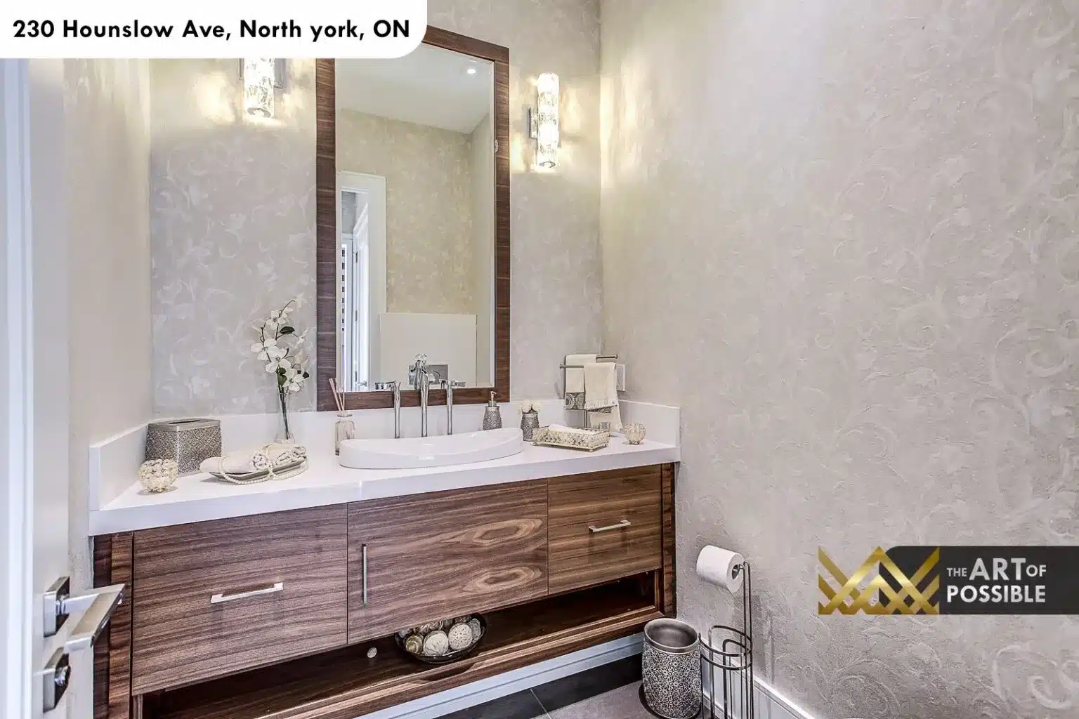 Main floor powder room with walnut floating vanity and textured silver wallpaper