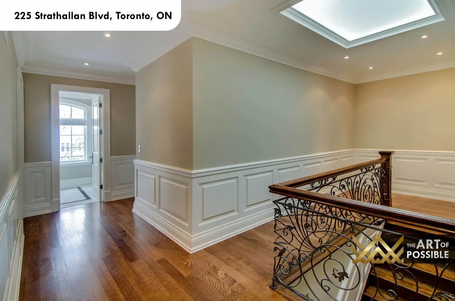 225 Strathallan Blvd Toronto - Upper landing with skylight and iron scrollwork railing