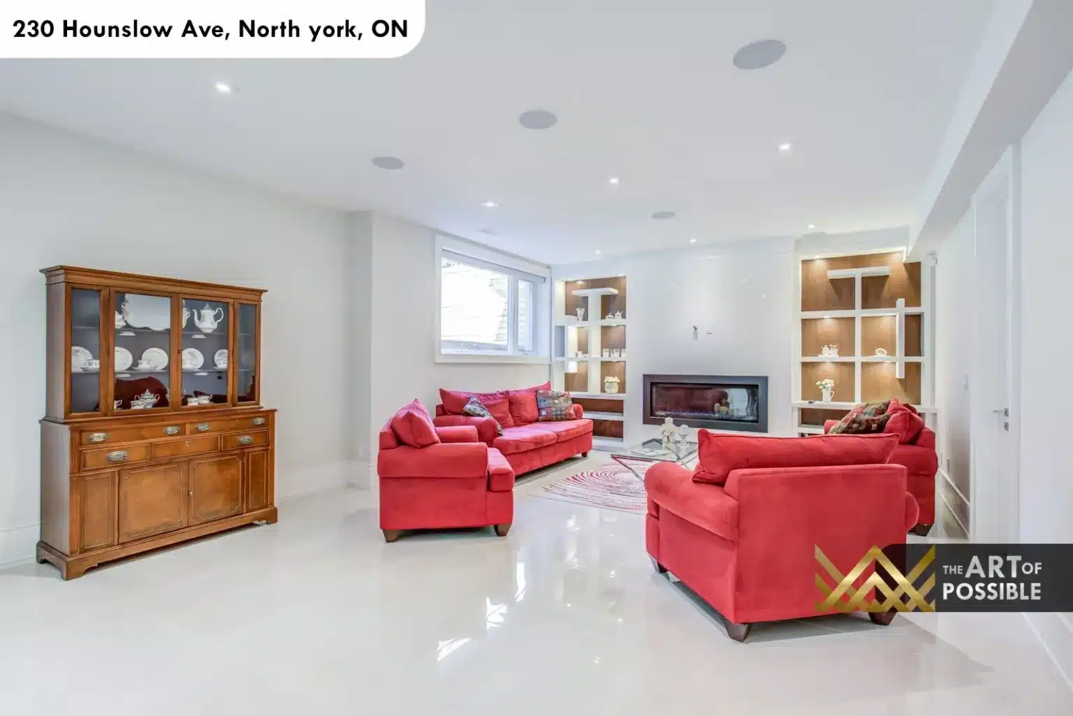 Lower level rec room at 230 Hounslow Ave with linear fireplace and illuminated shelving