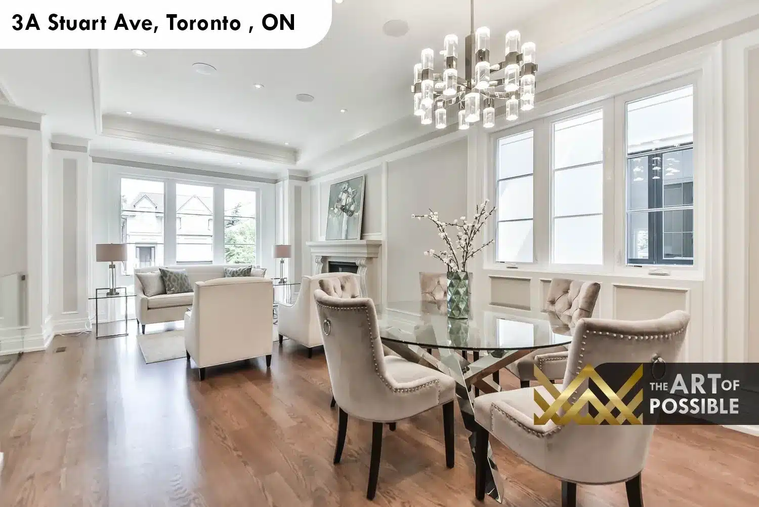 Open concept dining and living area at 3A Stuart Ave with white oak hardwood and tray ceilings