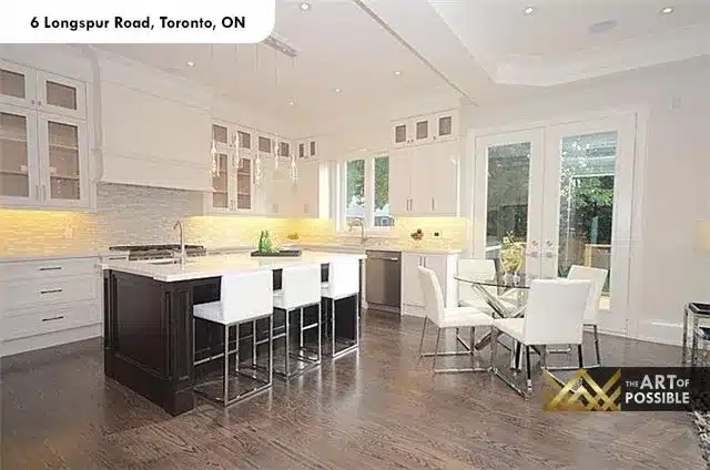 Open-concept kitchen and dining area with tray ceiling and French door walkout at 6 Longspur Rd Toronto
