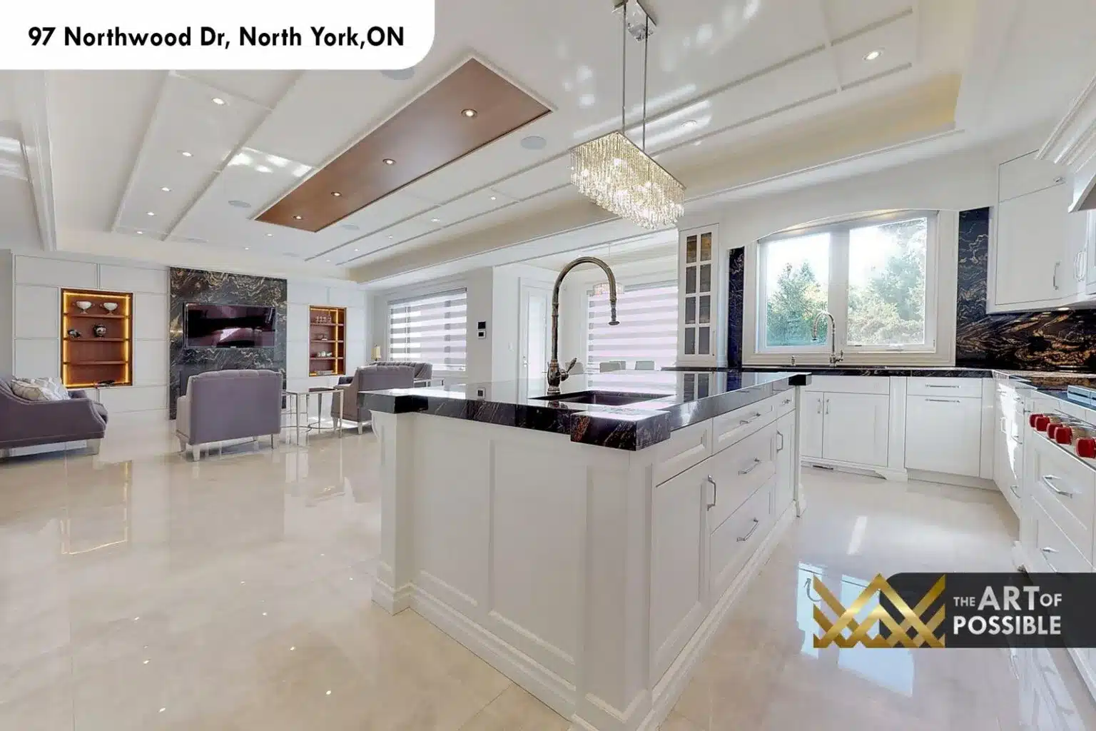 97 Northwood Dr kitchen island black marble countertop crystal chandelier open to family room