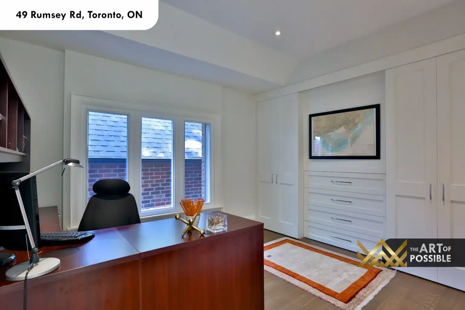49 Rumsey Rd home office upper level built-in cherry desk white cabinetry tray ceiling