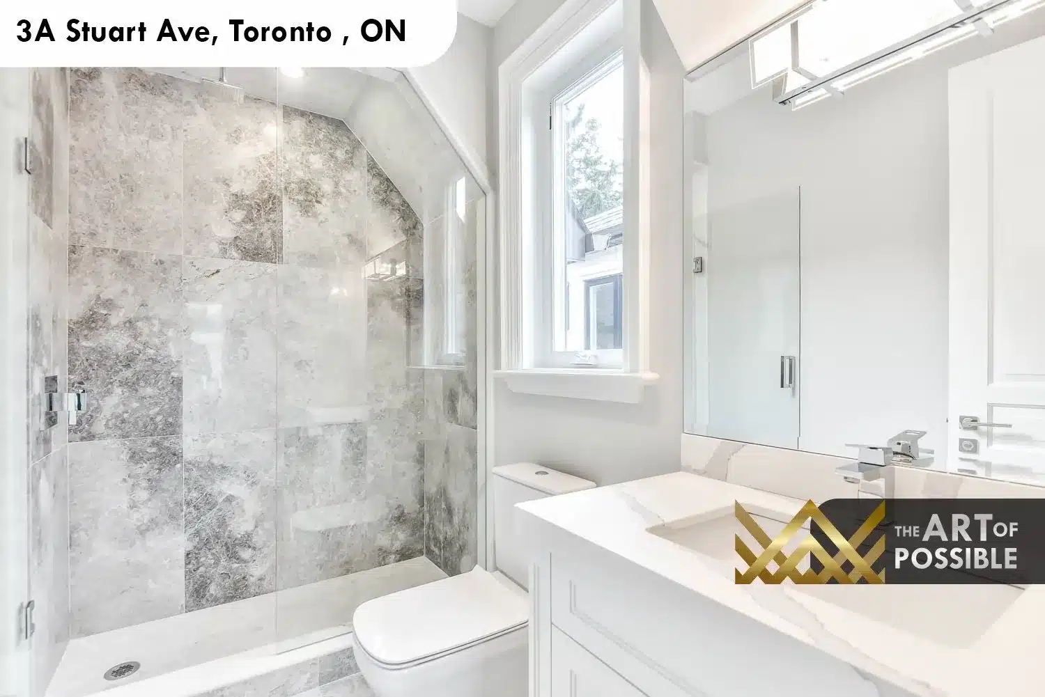 Third-floor secondary bathroom at 3A Stuart Ave with grey stone tile shower and white vanity
