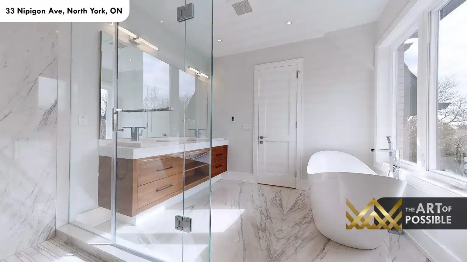 Primary ensuite with floating walnut double vanity, glass shower and freestanding soaker tub
