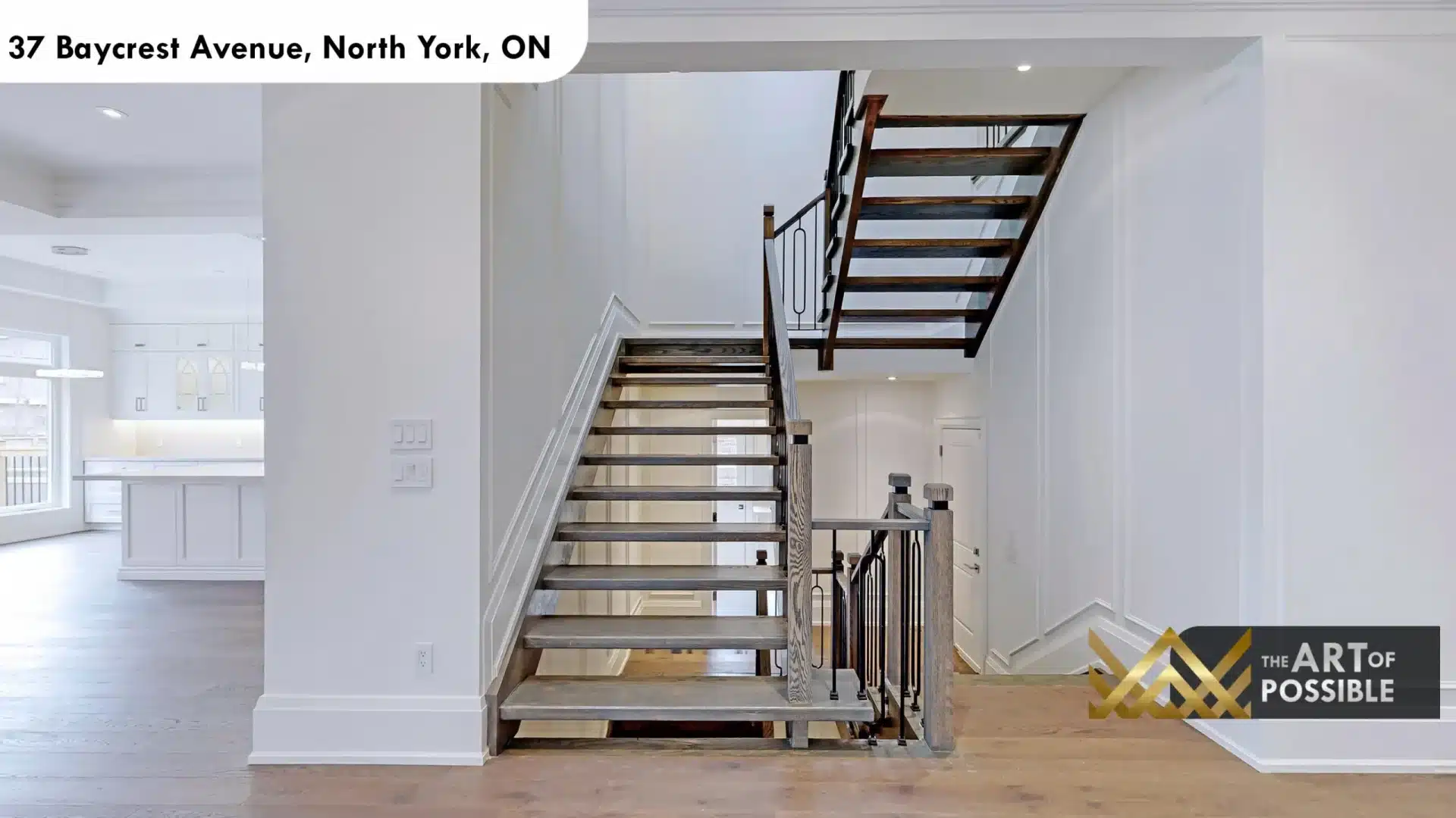 37 Baycrest Ave open tread oak staircase grey stained treads black iron balusters oval loop detail