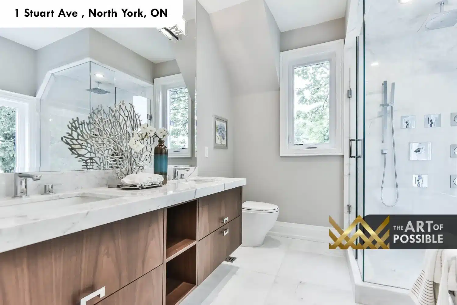 1 Stuart Ave primary ensuite walnut vanity marble countertop glass shower