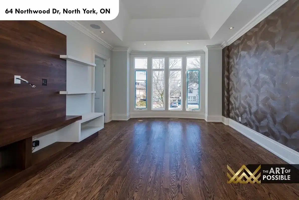 Secondary bedroom with walnut media unit and bay window