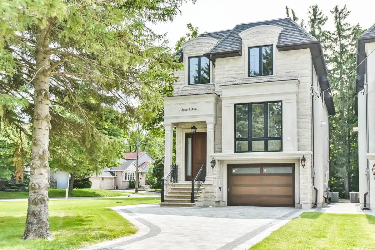 1 Stuart Ave, North York: Cut Stone Chateau Facade, Marble Waterfall Kitchen and a Vaulted Primary Suite with Skylit Glass-Railed Staircase
