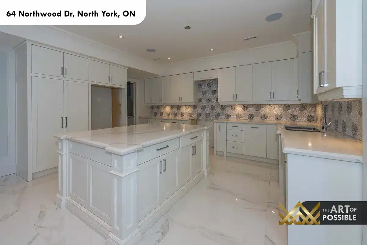 Main kitchen with white shaker cabinetry and botanical mosaic tile backsplash