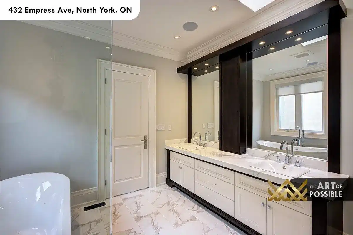 432 Empress Ave - primary ensuite double vanity with marble top and dark walnut framed mirrors