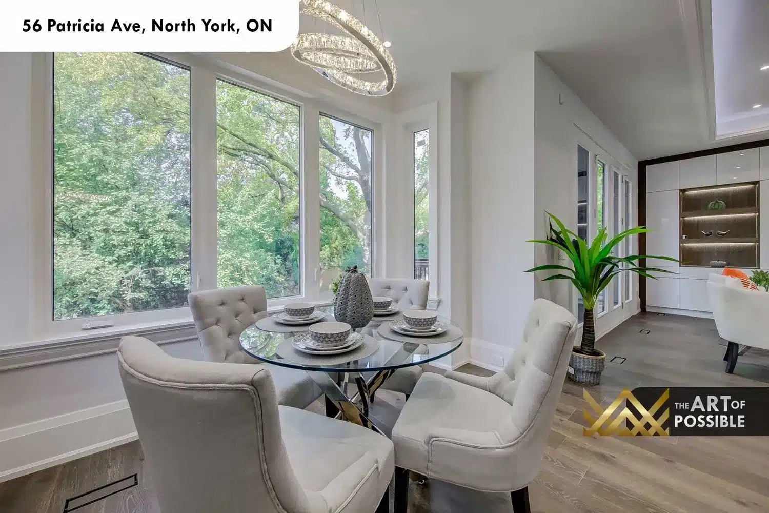 Breakfast nook showing picture windows and crystal pendant