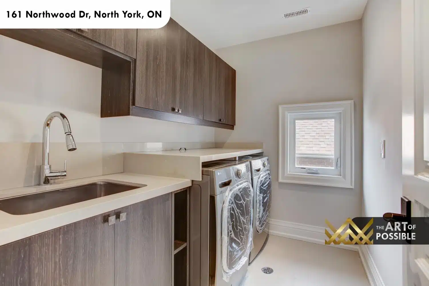 161 Northwood Dr North York upper floor laundry LG front load washer dryer quartz countertop dark cabinetry