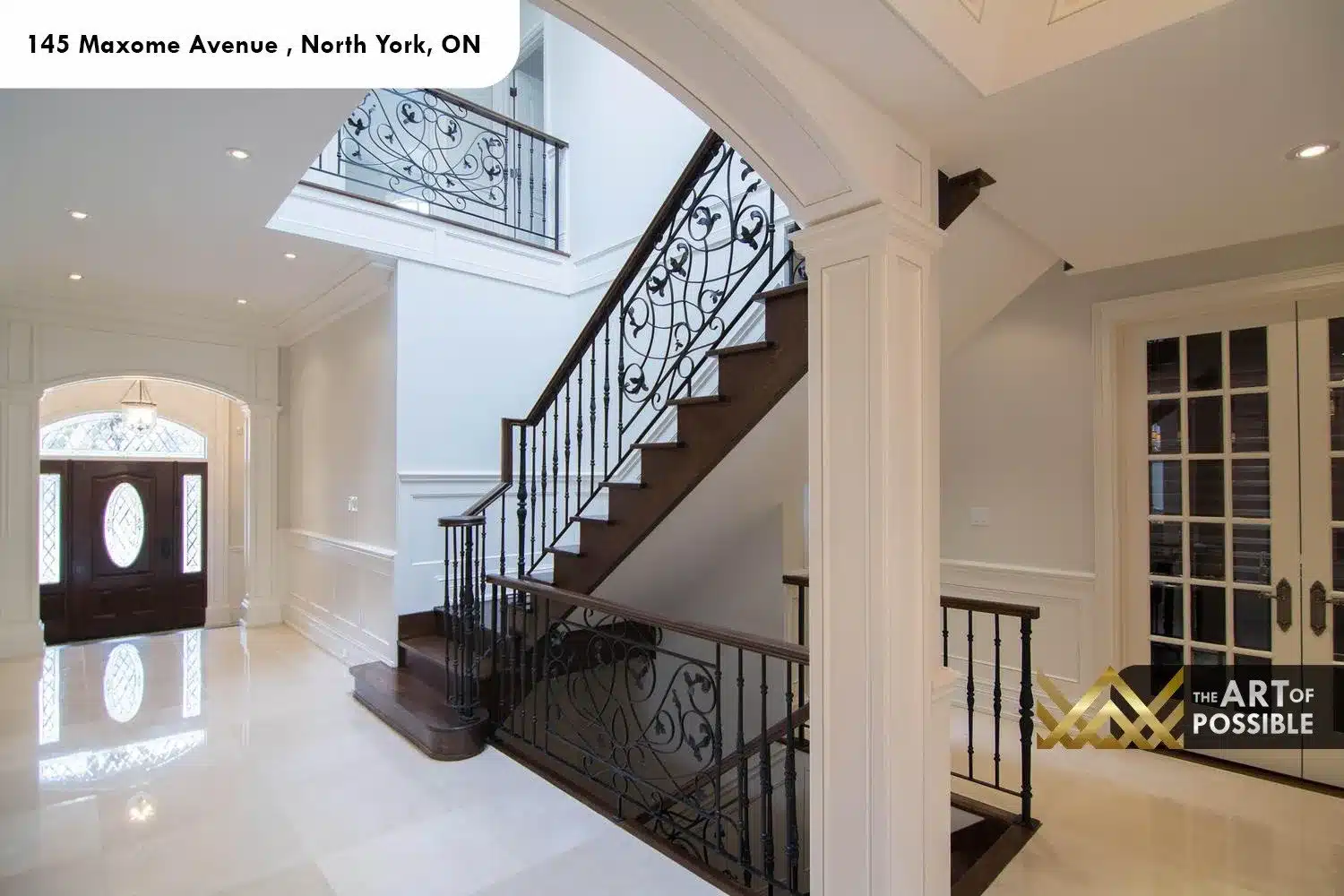 145 Maxome Avenue walnut staircase wrought iron scrolling balusters marble foyer French door library