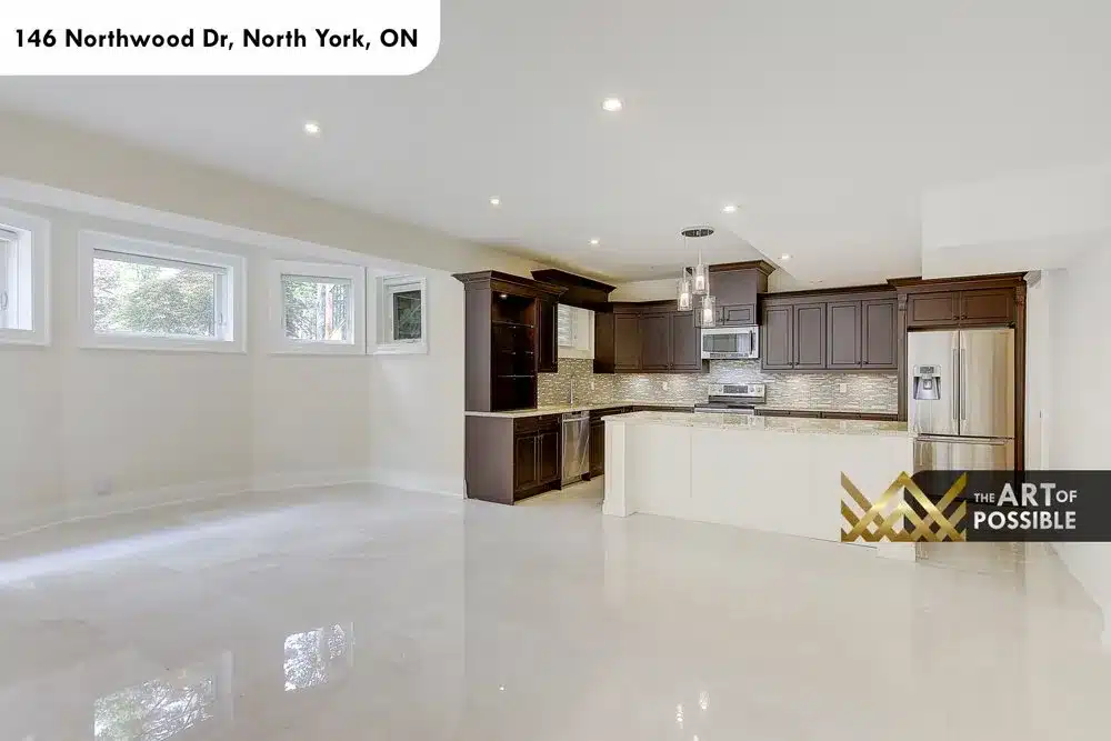 Second full kitchen on the lower level with espresso cabinets and white island