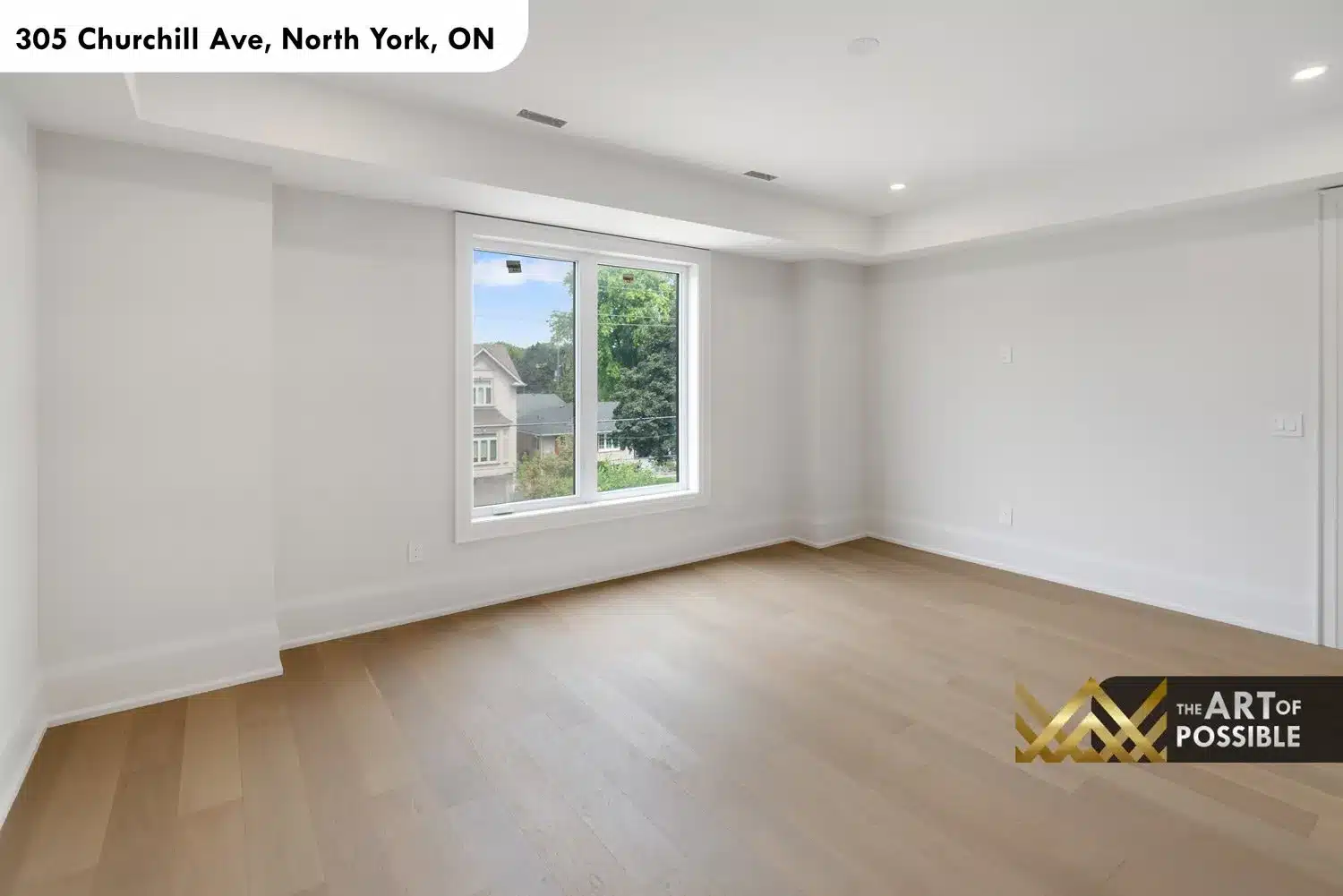 Secondary bedroom with front-facing windows and neighborhood views