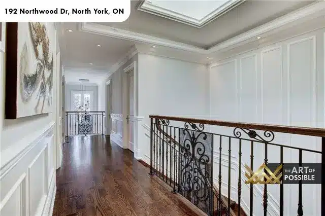 Upper floor hallway with iron railings and wainscoting, 192 Northwood Dr