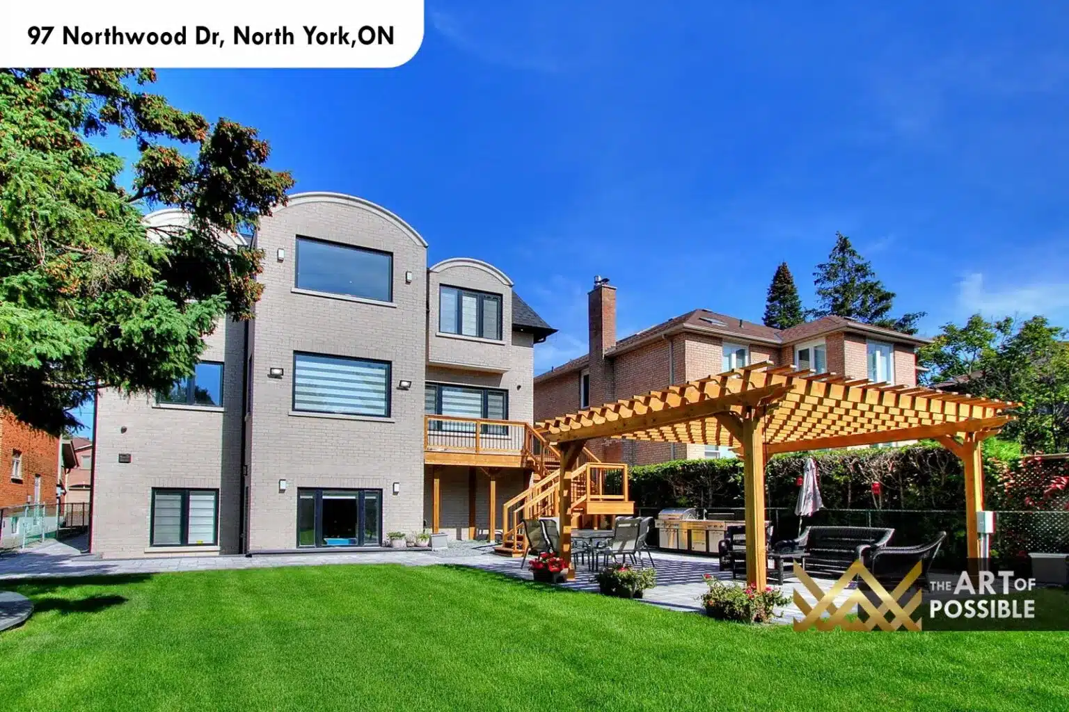 97 Northwood Dr rear elevation three storey stucco arched dormer pergola deck
