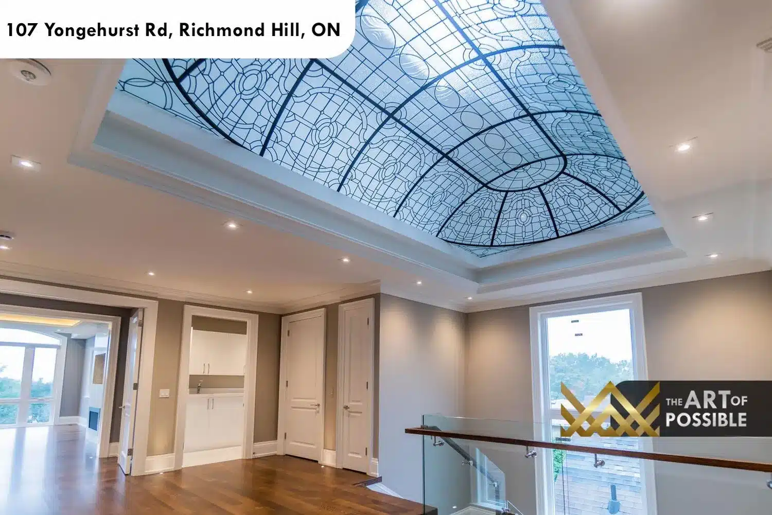 Upper landing with full-span leaded-glass skylight in black tracery cathedral pattern