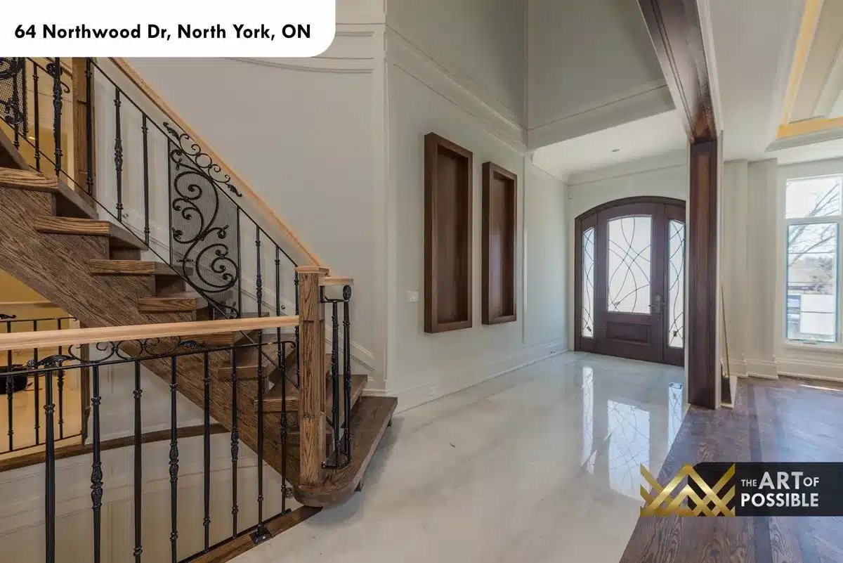 Foyer hallway with marble floors and leaded glass front door