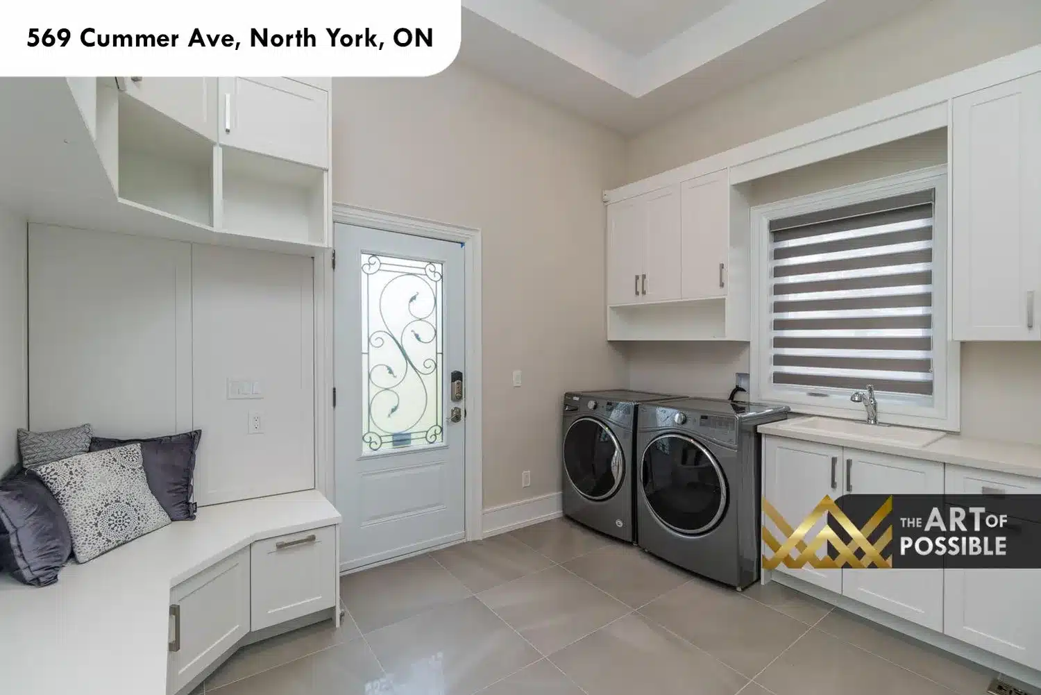 569 Cummer Ave laundry room front load washer dryer custom cabinetry utility sink tile floor