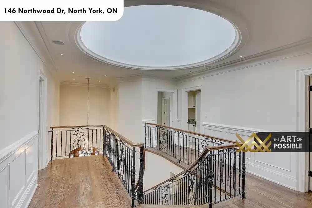Upper gallery landing with domed oval skylight and iron railings
