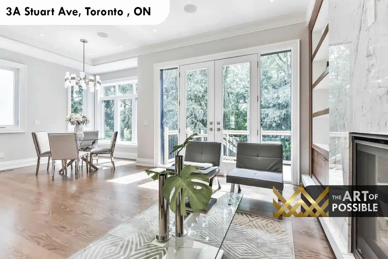 Family room walkout french doors to rear deck at 3A Stuart Ave with marble fireplace wall visible