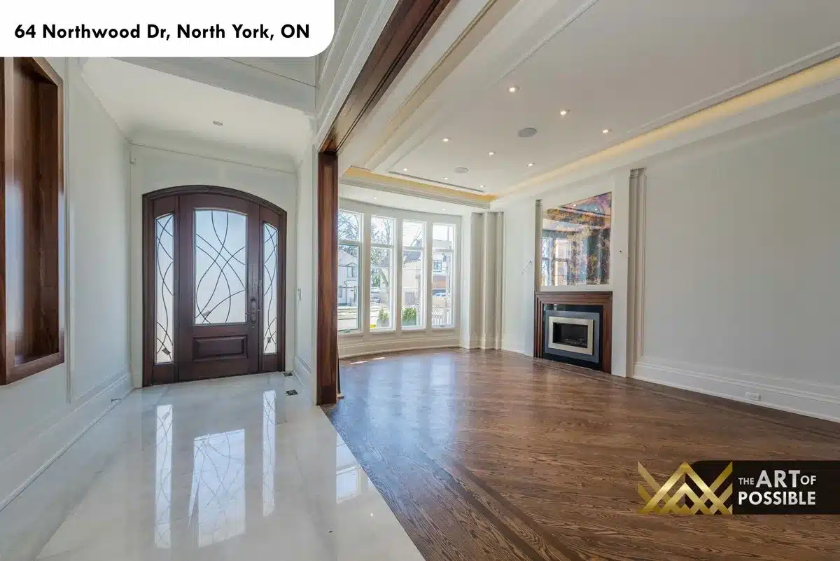 Formal living room with coffered tray ceiling and linear fireplace