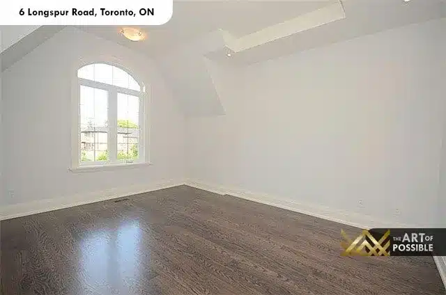 Secondary bedroom with vaulted ceiling, arched window and skylight at 6 Longspur Rd Toronto