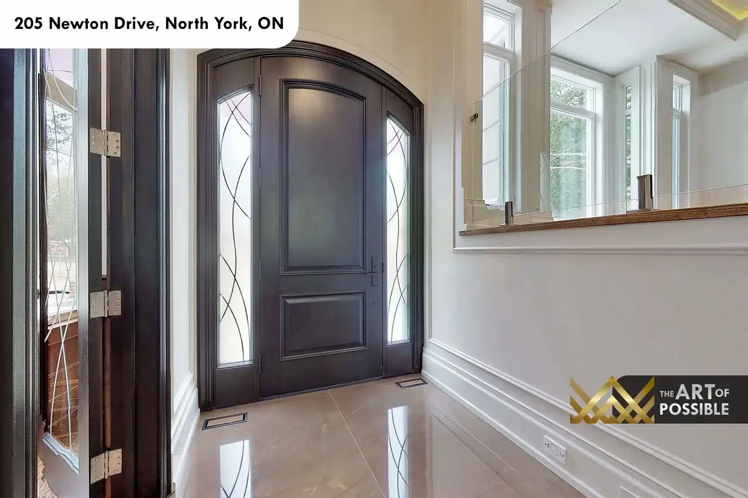 205 Newton Drive foyer arched leaded glass entry door marble floors