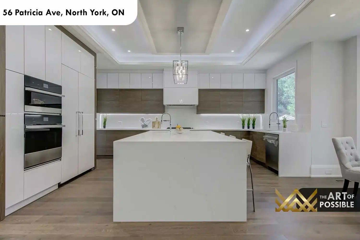 Kitchen at 56 Patricia Ave with two-tone cabinetry and white quartz island