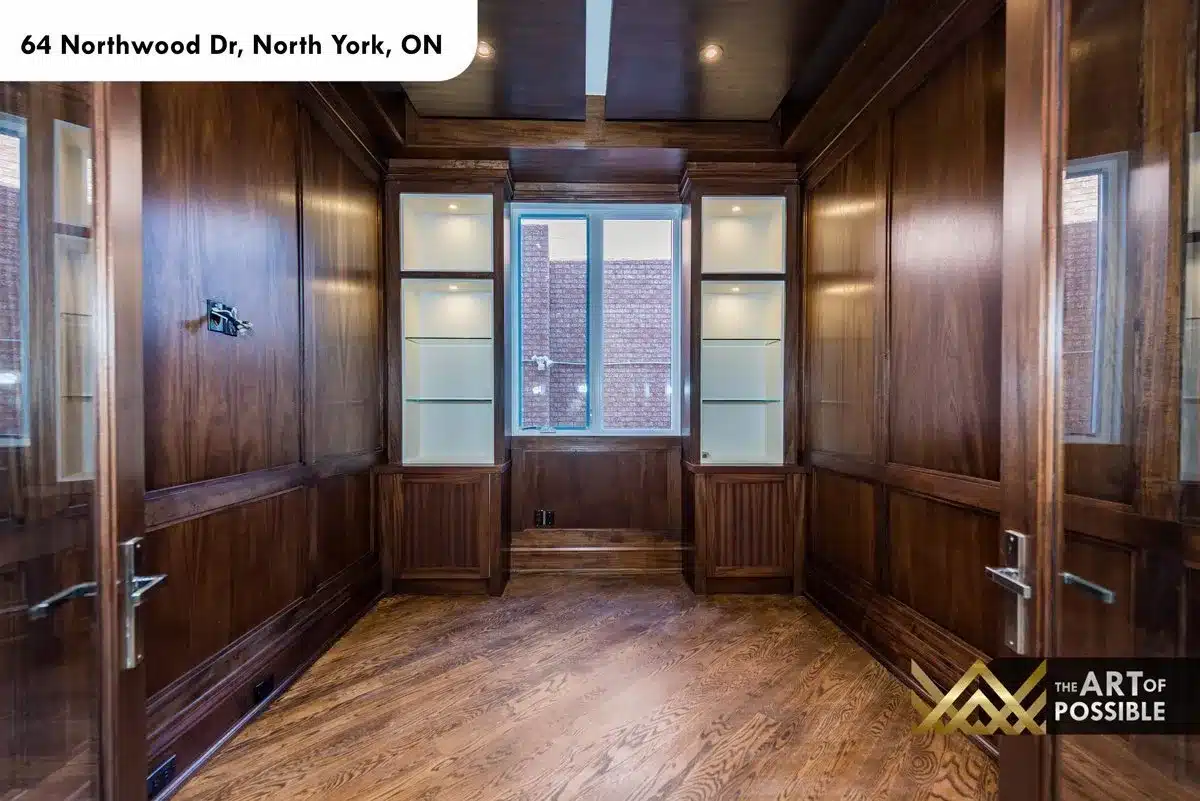 Walnut-paneled library with floor-to-ceiling built-in shelving