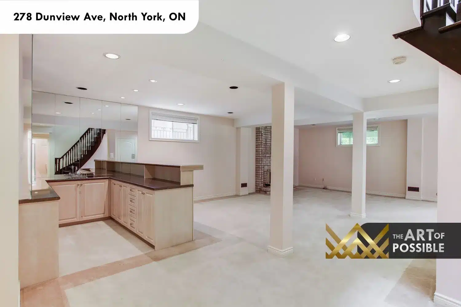Lower level recreation room with wet bar and mirrored back wall at 278 Dunview Ave