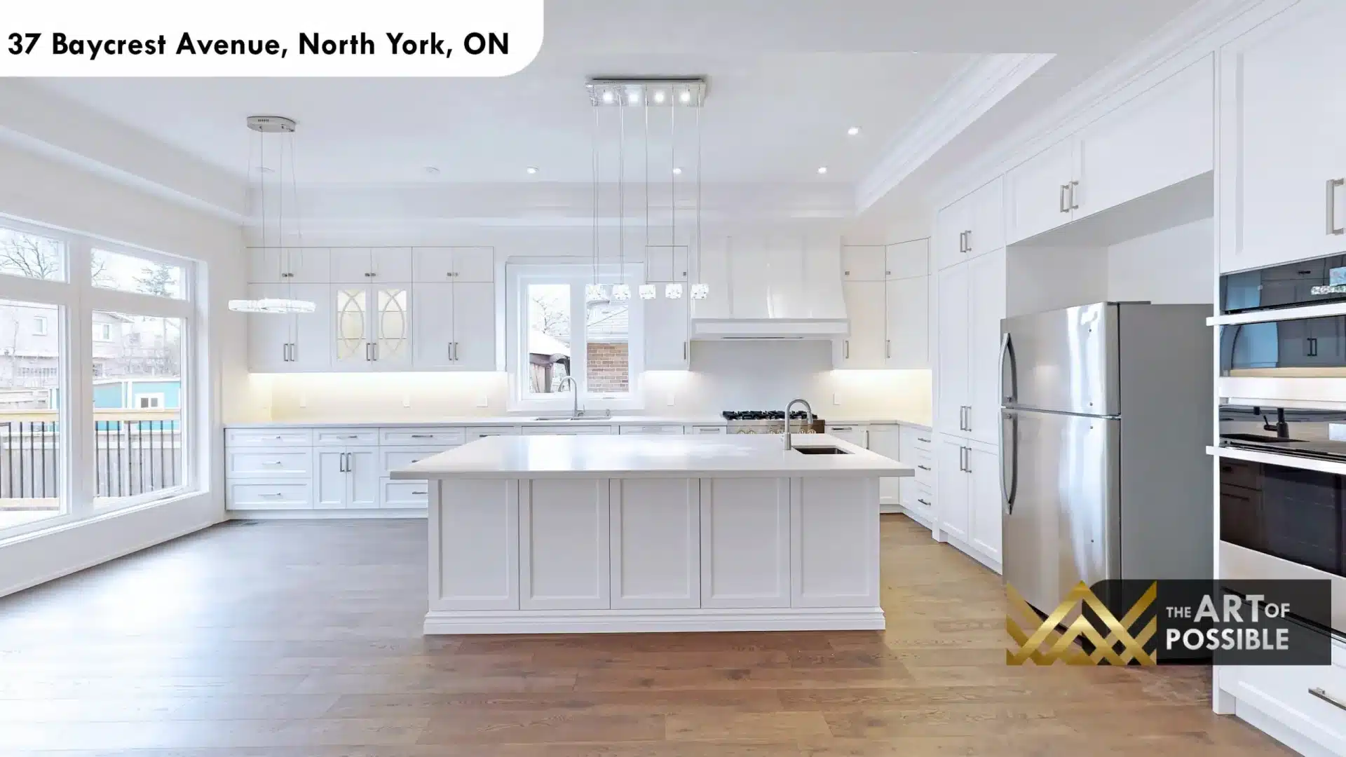 37 Baycrest Ave white shaker kitchen centre island crystal pendant lights gas range stainless appliances