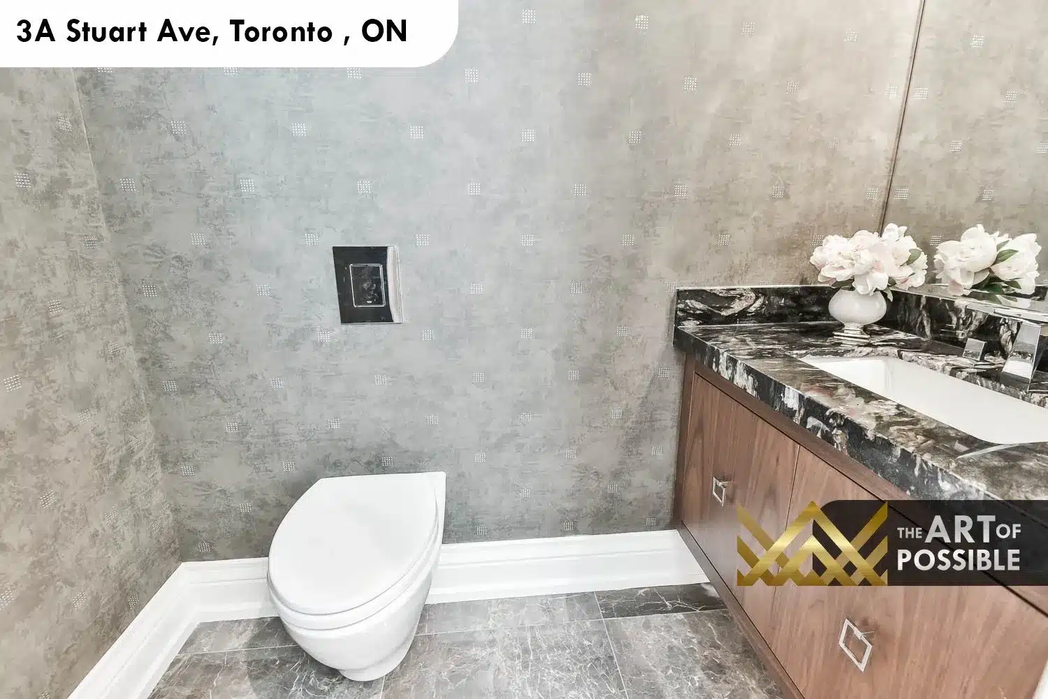 Main floor powder room at 3A Stuart Ave with dark marble vanity top and textured grey wallpaper