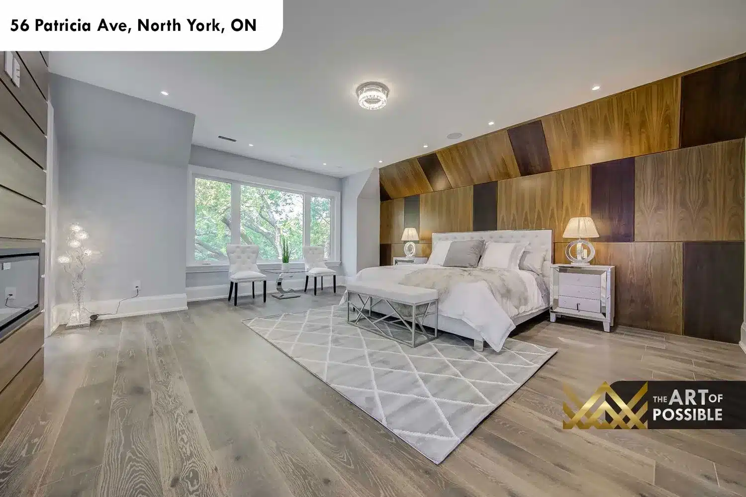 Primary bedroom at 56 Patricia Ave with two-tone walnut panel wall