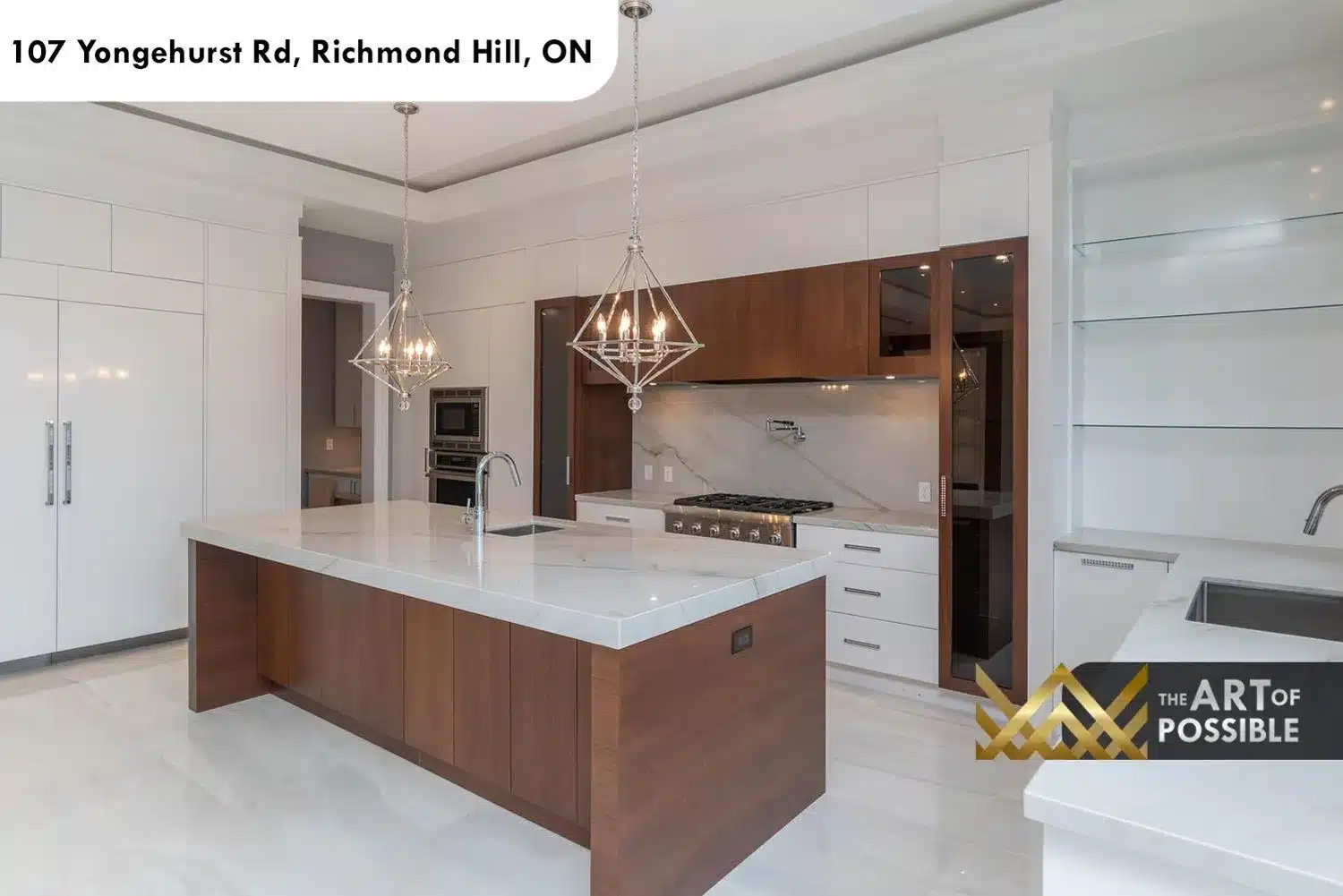 Kitchen island and six-burner gas range with chrome pot filler and marble slab backsplash