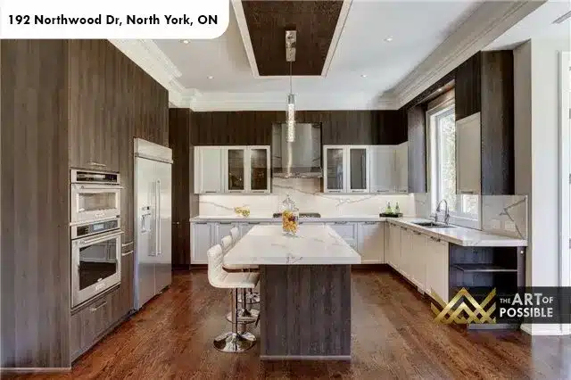 Kitchen alternate angle showing Calacatta marble backsplash and bar stools