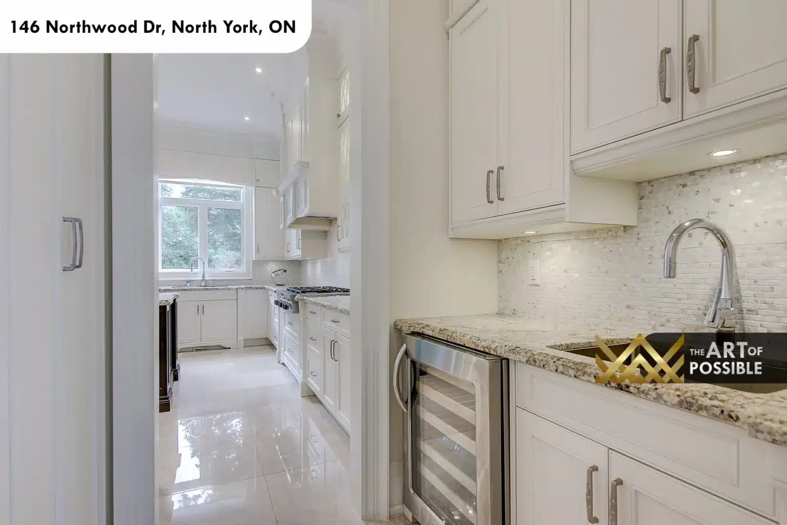 Great room and gourmet kitchen with dark island and granite counters at 146 Northwood Dr
