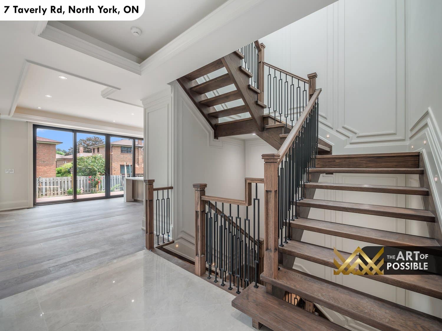 Floating dark oak staircase with black iron balusters