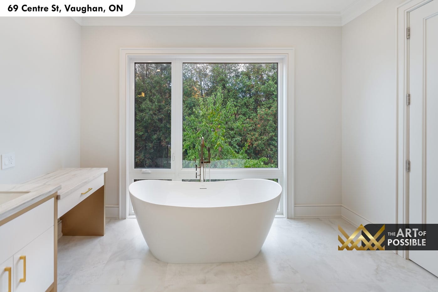Freestanding oval soaker tub with chrome floor filler and garden-view window