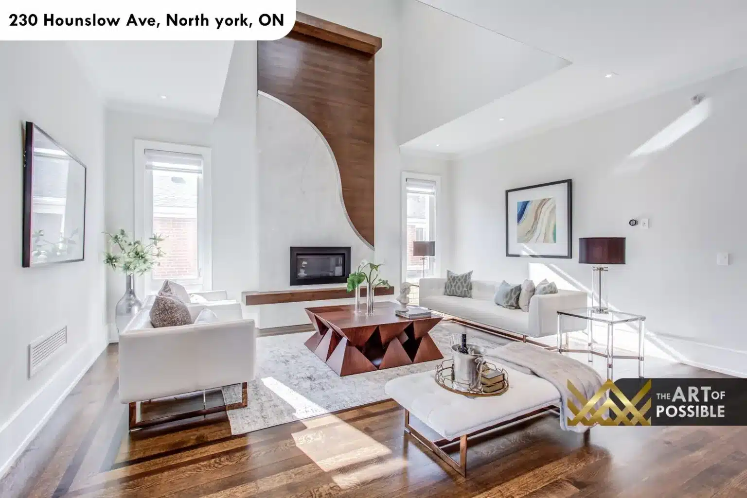 Formal living room at 230 Hounslow Ave with sculptural walnut and plaster fireplace wall