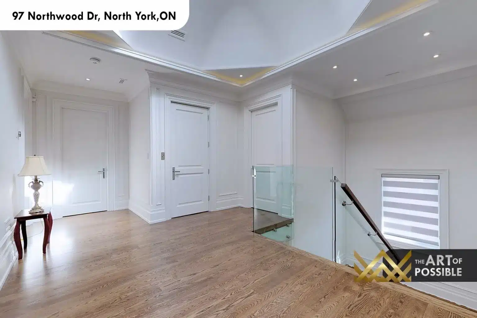 97 Northwood Dr upper floor landing octagonal coffered ceiling hardwood floors glass railing