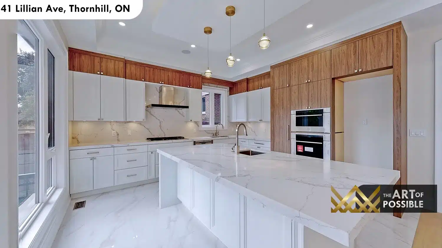 41 Lillian Ave Thornhill kitchen white marble waterfall island walnut upper cabinets globe pendants