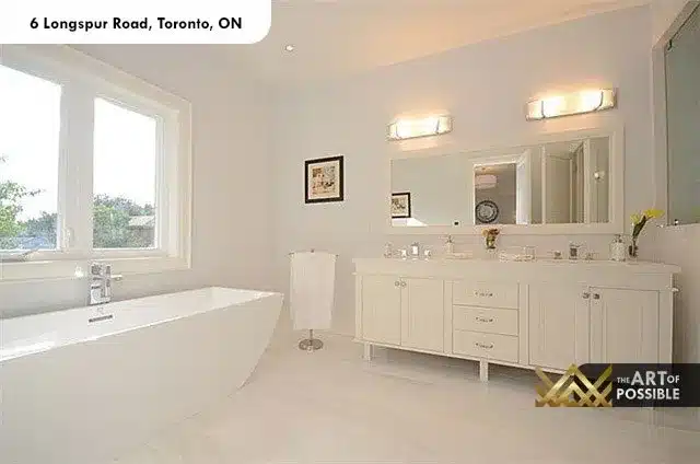 All-white primary ensuite with freestanding soaker tub and double vanity at 6 Longspur Rd Toronto