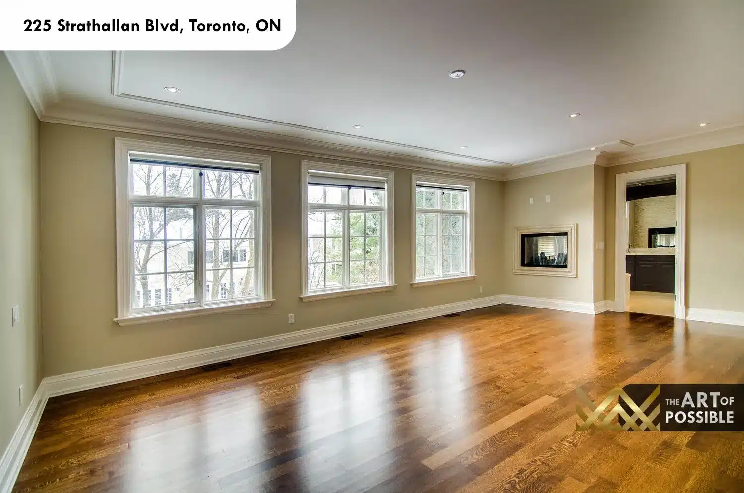 225 Strathallan Blvd Toronto - Primary bedroom with three windows and fireplace